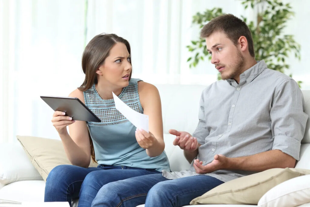 COUPLE TALKING ABOUT INSURANCE CLAIM